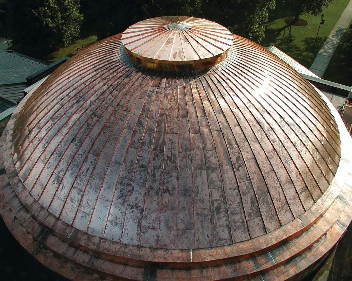 Craftsman Roofing crew installing a new roof in St. Johnsbury